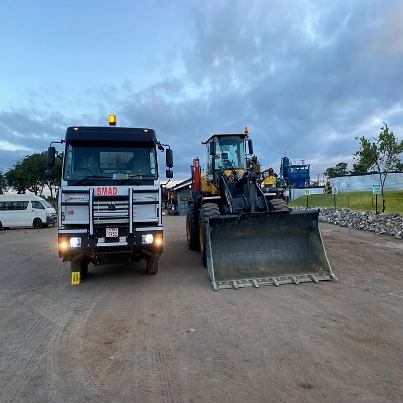 Smad tipper truck and wheel loader at the plant yard